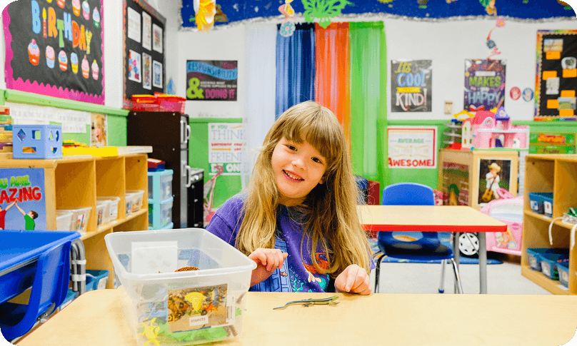 Happy child at learning table
